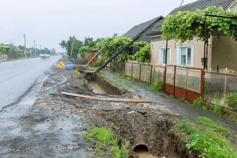 Accident caused severe damage to multiple electrical poles along the road. Stock Photos