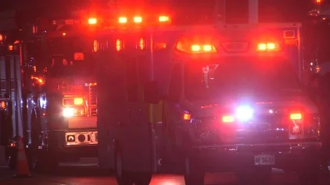 Accident at night in city intersection with ambulance and police at crash scene Stock Footage 82987959
