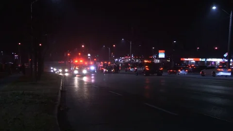 Accident at night in city intersection with ambulance and police at crash scene Stock Footage 82988580