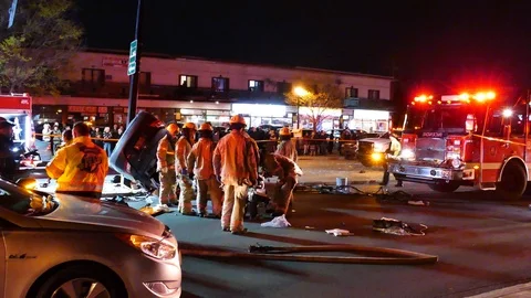 Accident scene with first responders and victim Stock Footage 114946643