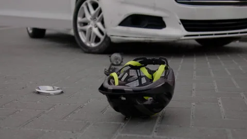Accident is visible on road surface impact of car hitting electric scooter. This Stock Footage 272965251