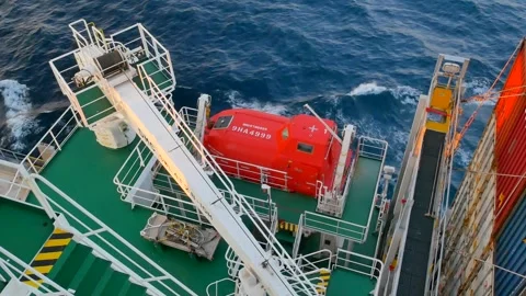 Accommodation part of ultralarge container ship with ship crane and lifeboat Stock Footage 262849829