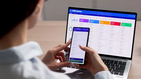 Account Manager Studies Sales Data On Laptop Video stock 335880689