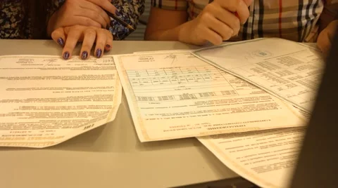 Accountant and manager checking/comparing data- insurance Video stock 52543124