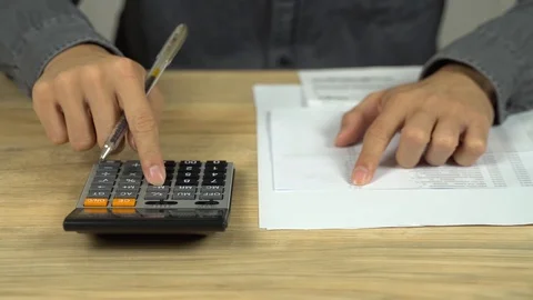 Accountant bussinessman checking a list making calculation hand pen working Video stock 113147232