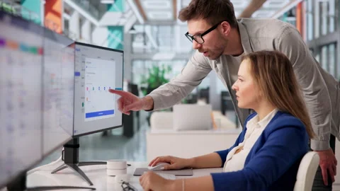 Accountant Carefully Using Computer To Manage Payroll Stock Footage 331519521
