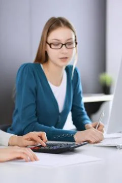 Accountant checking financial statement or counting by calculator income for tax Stock Photos