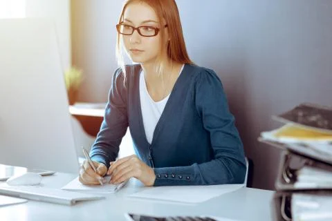 Accountant checking financial statement or counting by calculator income for tax Stock Photos