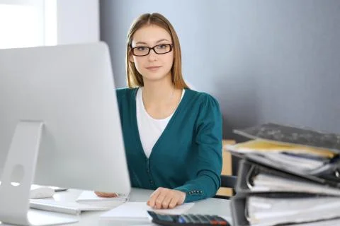 Accountant checking financial statement or counting by calculator income for tax Foto stock
