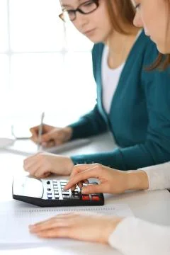 Accountant checking financial statement or counting by calculator income for tax Stock Photos