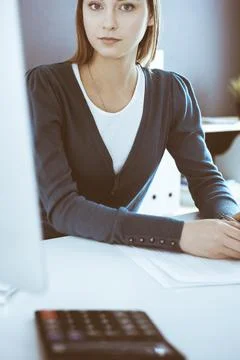 Accountant checking financial statement or counting by calculator income for tax Stock Photos
