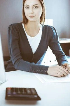 Accountant checking financial statement or counting by calculator income for tax Stock Photos