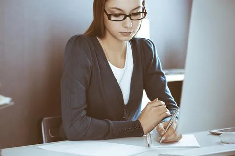 Accountant checking financial statement or counting by calculator income for tax Foto stock