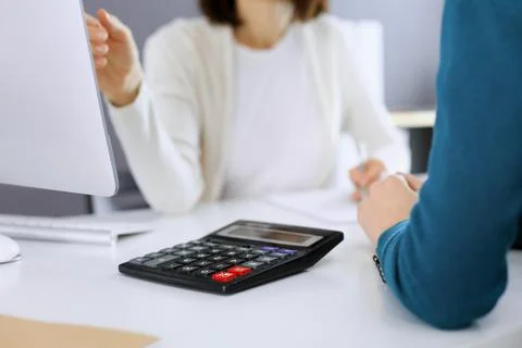 Accountant checking financial statement or counting by calculator income for tax Stock Photos
