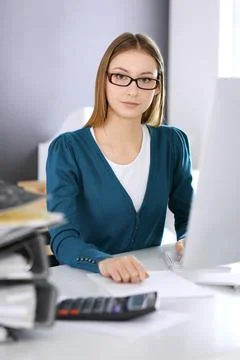 Accountant checking financial statement or counting by calculator income for tax Stock Photos