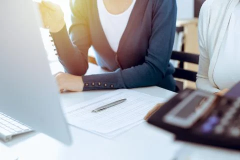 Accountant checking financial statement or counting by calculator income for tax Foto stock