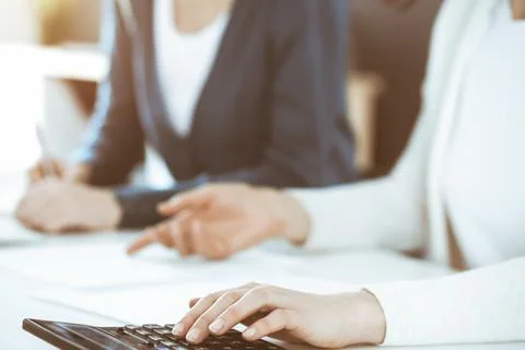 Accountant checking financial statement or counting by calculator income for tax Stock Photos