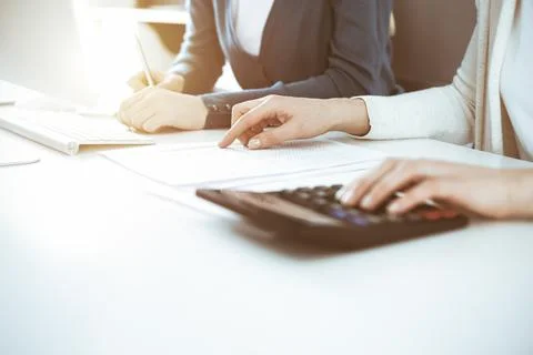 Accountant checking financial statement or counting by calculator income for tax Stock Photos
