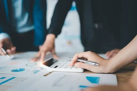 Accountant checking financial statement or counting by calculator income for tax Stock Photos
