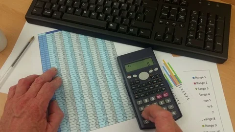 Accountant checking spreadsheet and inputting on computer keyboard Stock Footage 78166971