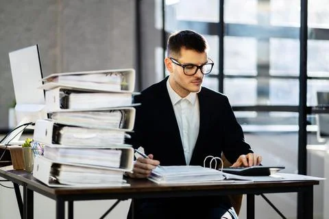Accountant With Folders Paper Stack Doing Invoice 스톡 사진