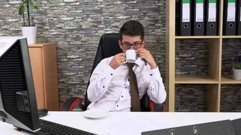 Accountant in the office is drinking coffee talking to a client Stockbeeldmateriaal 116238297