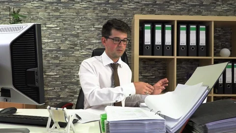 Accountant is sorting documents in the office at the table Stock Footage 115695766