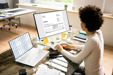 Accountant Using E Invoice Software At Computer Stock Photos
