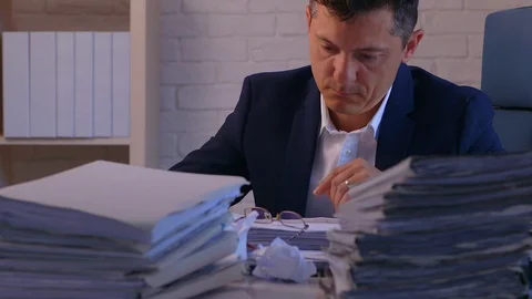 Accountant working on a file folder at his desk. 스톡 동영상 129523859