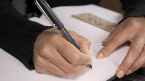 Accountant writing a note for five hundred dollars accounts payable 4k. Stock Footage 96019952