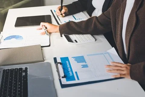 Accountants processing financial documents and taxes, managing corporate fi.. Stockfoto's