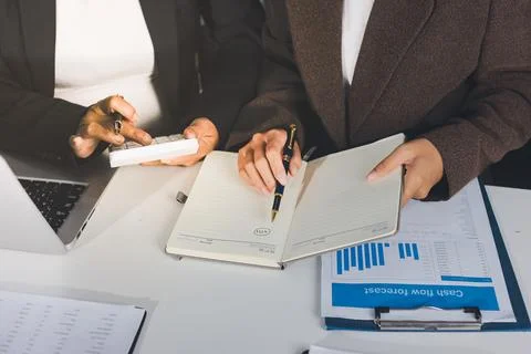 Accountants processing financial documents and taxes, managing corporate fi.. Foto stock