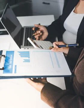 Accountants processing financial documents and taxes, managing corporate fi.. Stockfoto's