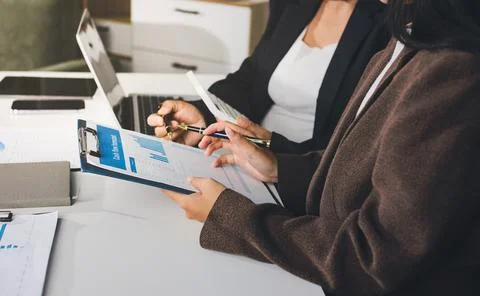Accountants processing financial documents and taxes, managing corporate fi.. Stockfoto's