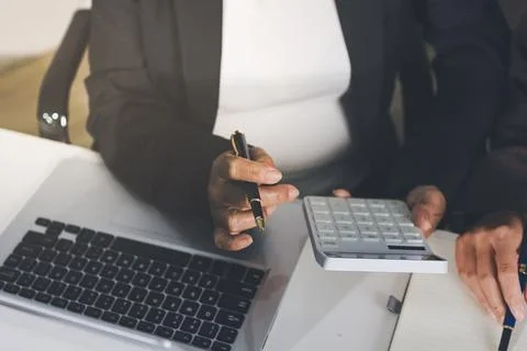 Accountants processing financial documents and taxes, managing corporate fi.. Foto stock