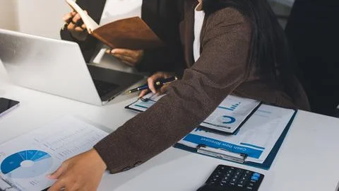 Accountants processing financial documents and taxes, managing corporate fi.. Foto stock