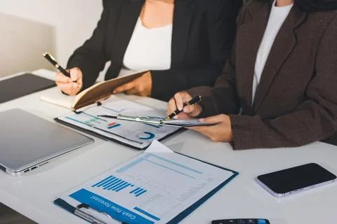 Accountants processing financial documents and taxes, managing corporate fi.. Stockfoto's