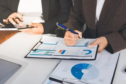 Accountants processing financial documents and taxes, managing corporate fi.. Stockfoto's