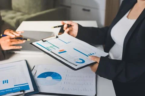 Accountants processing financial documents and taxes, managing corporate fi.. Stockfoto's
