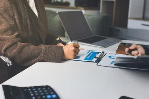 Accountants processing financial documents and taxes, managing corporate fi.. Stockfoto's