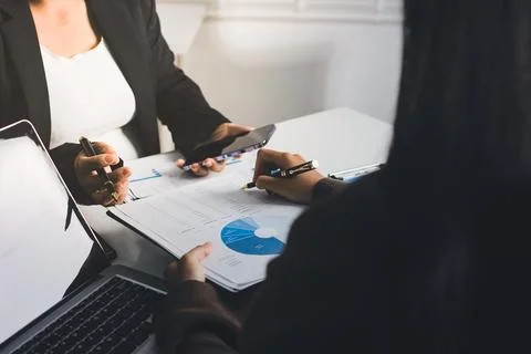 Accountants processing financial documents and taxes, managing corporate fi.. Stockfoto's