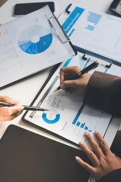 Accountants processing financial documents and taxes, managing corporate fi.. Foto stock