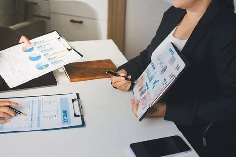Accountants processing financial documents and taxes, managing corporate fi.. Stock Photos