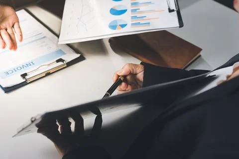 Accountants processing financial documents and taxes, managing corporate fi.. Stockfoto's
