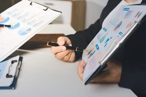 Accountants processing financial documents and taxes, managing corporate fi.. Stockfoto's