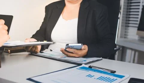 Accountants processing financial documents and taxes, managing corporate fi.. Stockfoto's