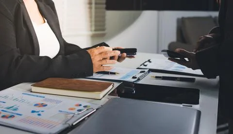 Accountants processing financial documents and taxes, managing corporate fi.. Stockfoto's