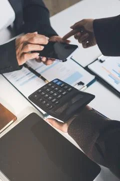 Accountants processing financial documents and taxes, managing corporate fi.. Stockfoto's