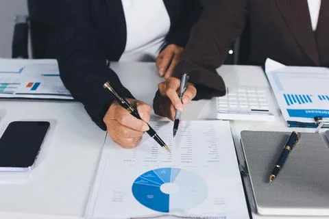 Accountants processing financial documents and taxes, managing corporate fi.. Foto stock