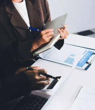 Accountants processing financial documents and taxes, managing corporate fi.. Foto stock